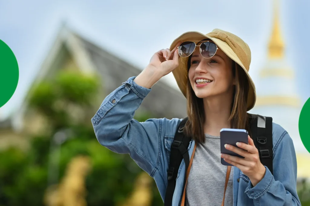 Person inserting an international SIM card into a smartphone